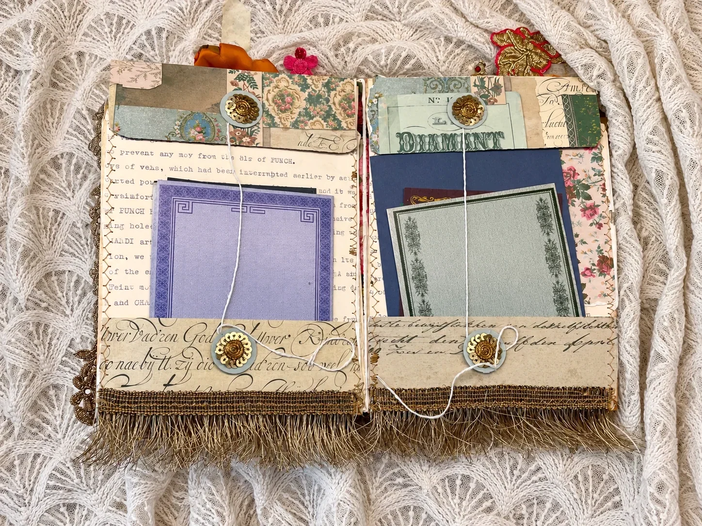A double opening in After the Wedding with writing pads, layered vintage papers and button-and-string closures