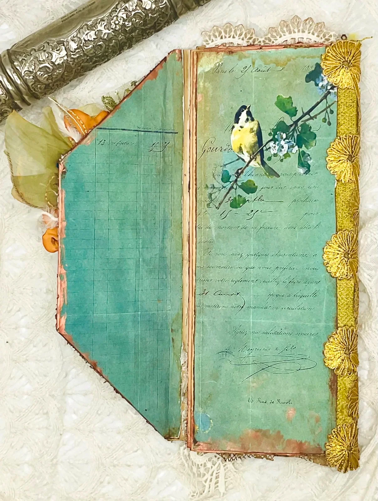 The inside cover of The Birds Remember with a painted bird page and green paper