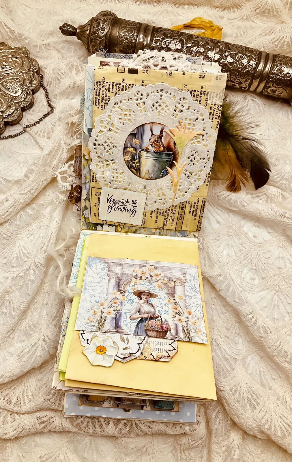 The Book of Garden opened to an illustrated circular botanical page and yellow pocket