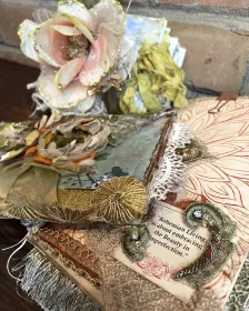 The Garden and After the Wedding artist journals arranged together with handmade flowers, sari silk and lace