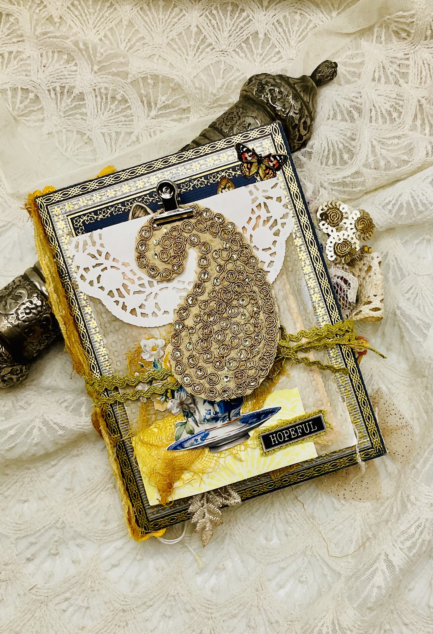 Detail of Chinoiserie journal cover showing vintage envelope and embellishments