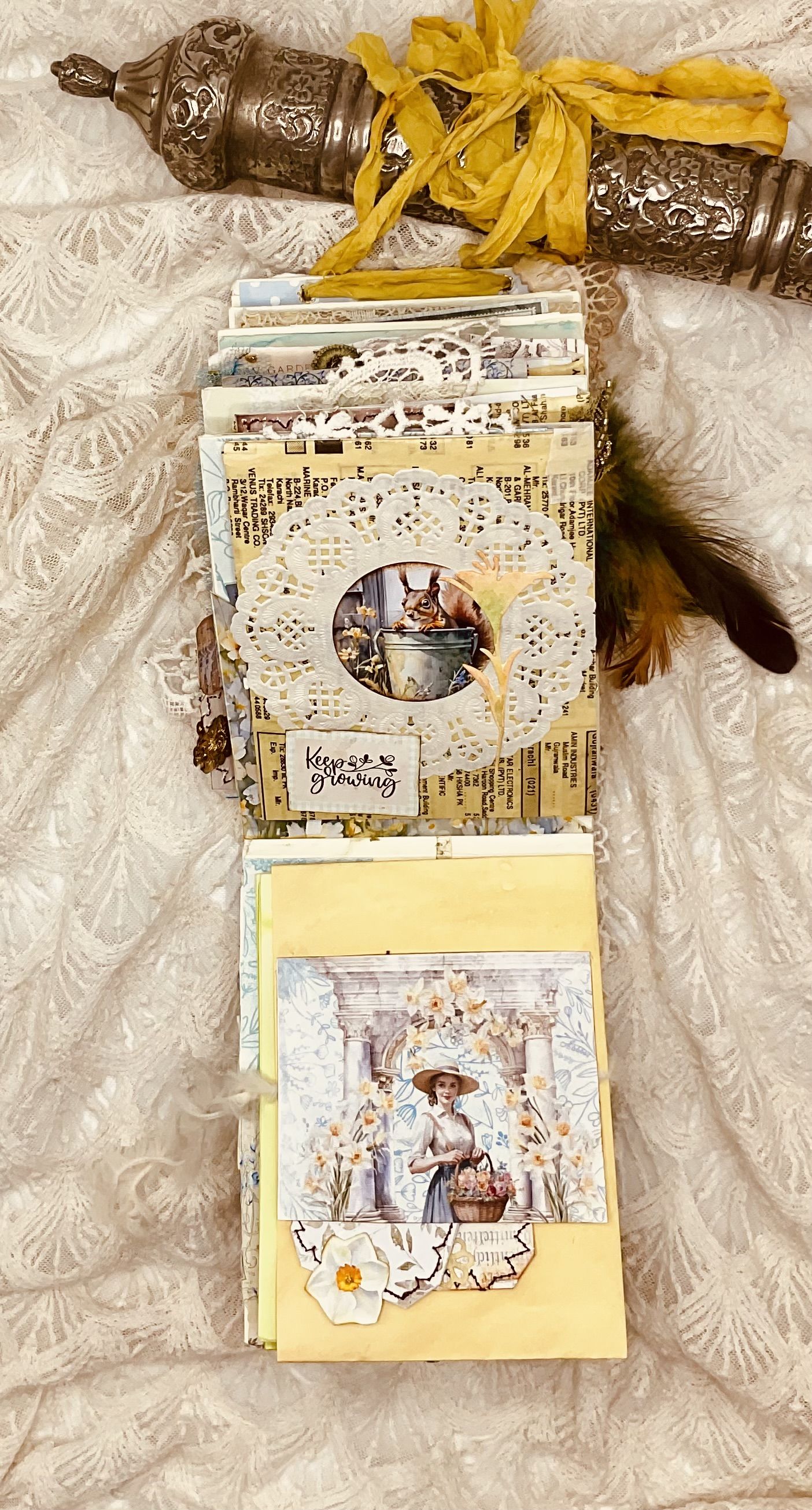 Materials and supplies used to create handmade garden-themed Seed Packet Junk Journal