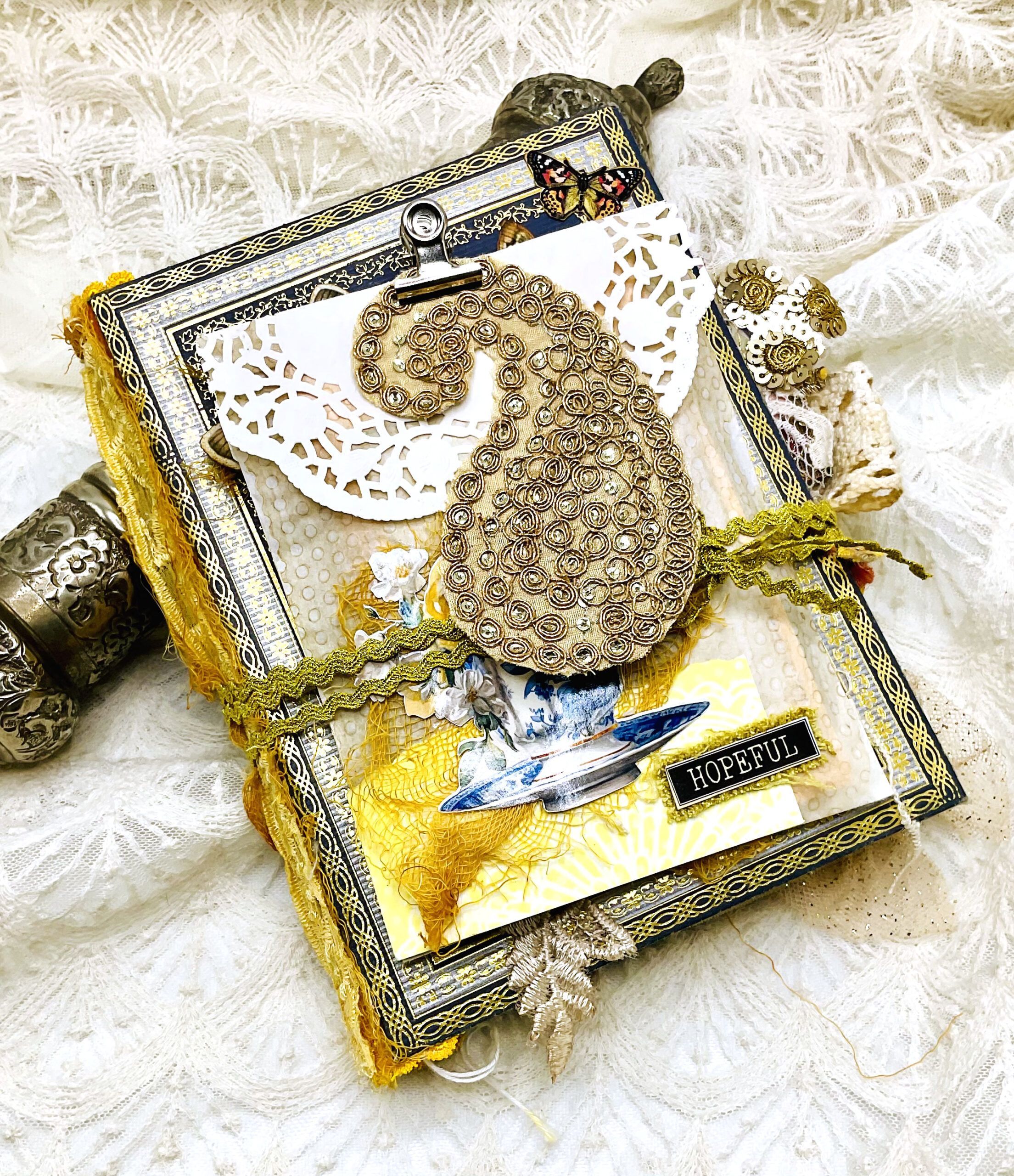 chino Handmade Chinoiserie junk journal cover with vintage floral design and fabric spine — detailed craft texture showing materials used in a handmade junk journal