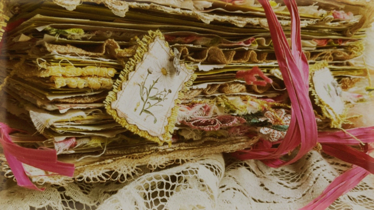 home-page-image Open junk journal spread with handmade tea-dyed pages, vintage ephemera, and layered paper textures — a completed Trinketz junk journal