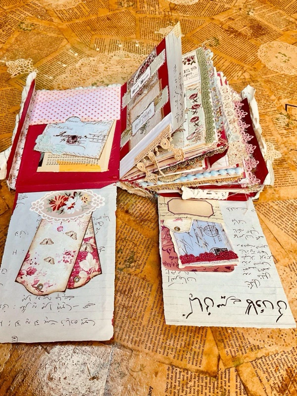 Book of Ritz junk journal in progress with vintage papers and handmade ephemera