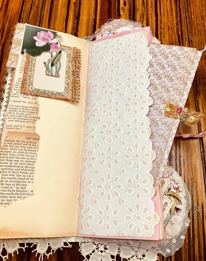 Layered papers, lace and floral images in the Cherry Blossom junk journal