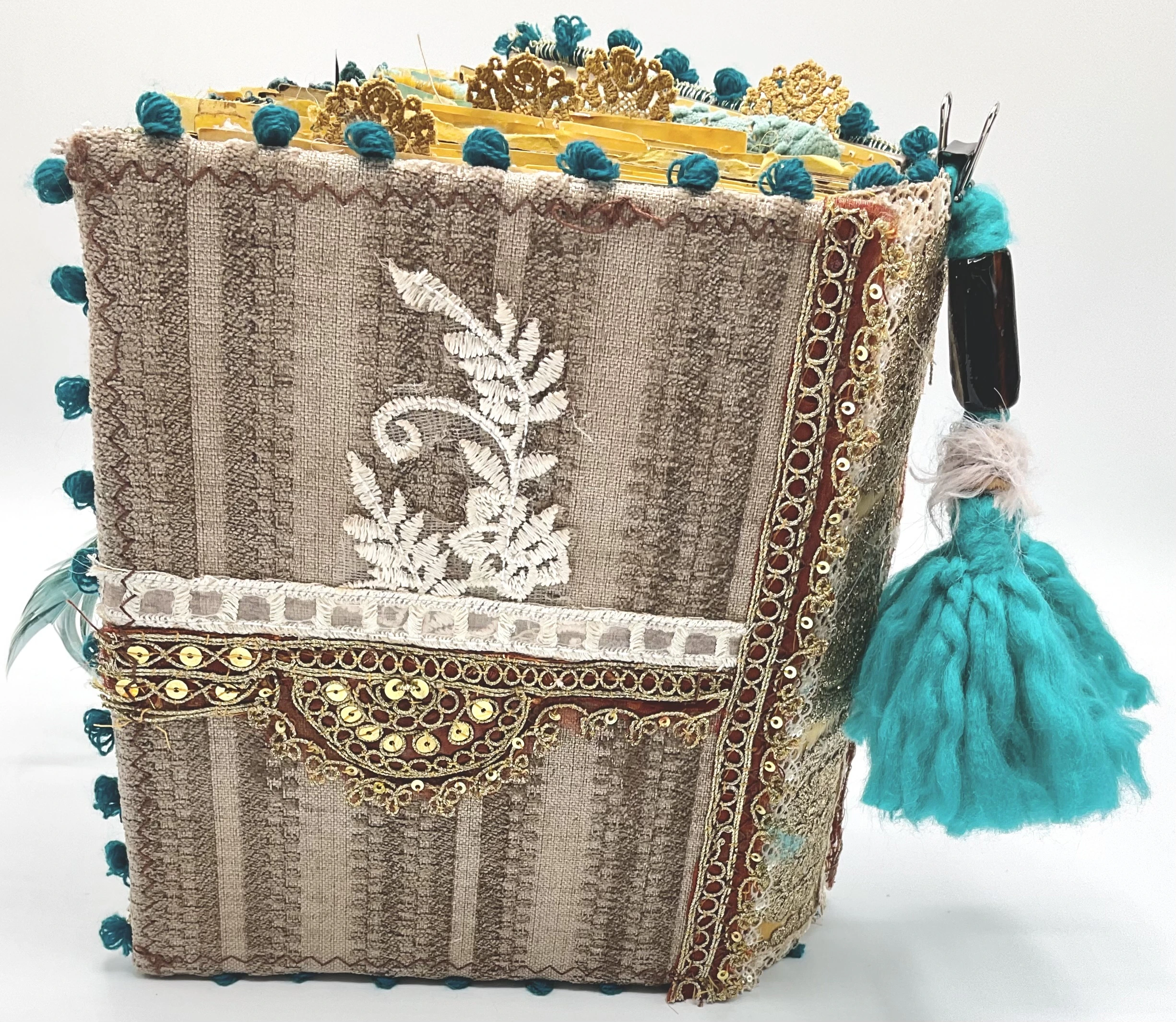 Teal and gold fabric junk journals collection tied with teal ribbons