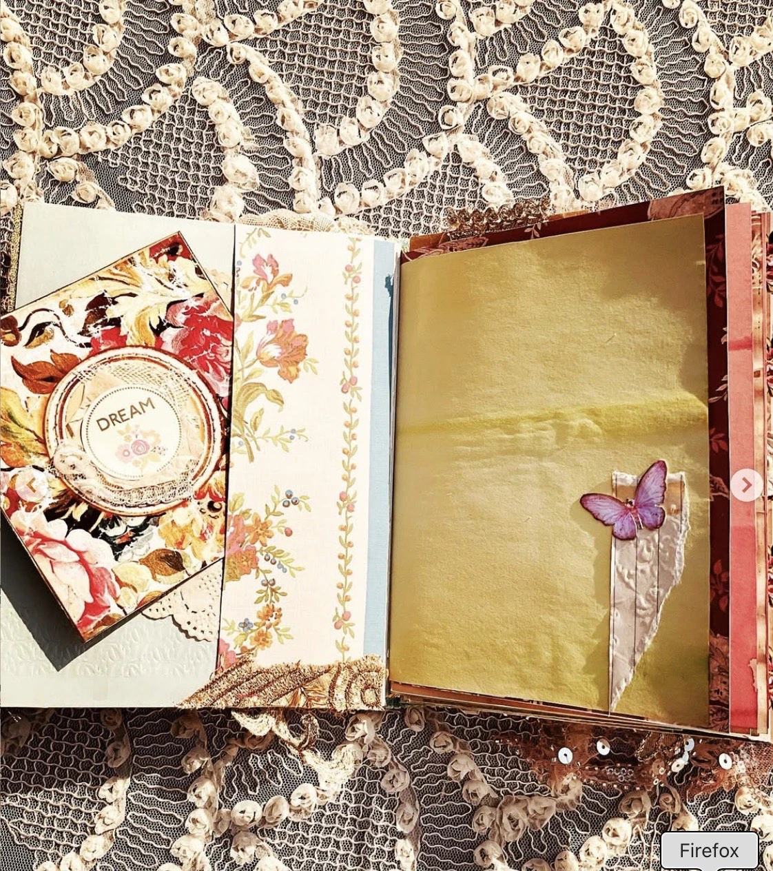 Soft pink writing page spread inside the vintage blue envelope junk journal