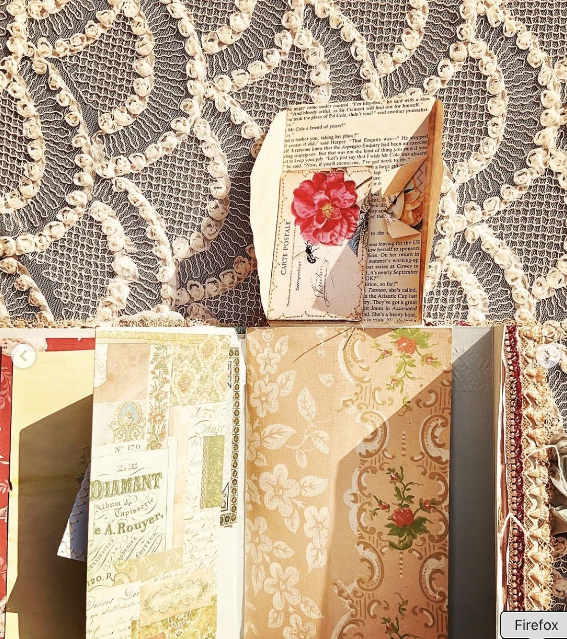 Lace and embellishment detail on the vintage blue envelope junk journal