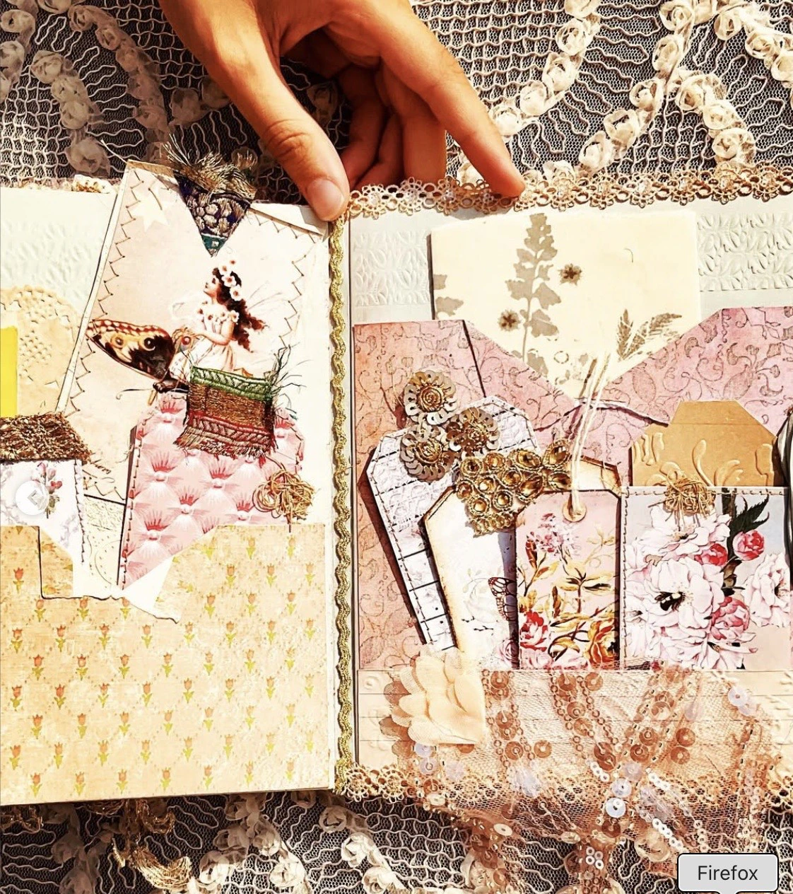 Technique detail with layered papers and lace on the vintage blue envelope junk journal